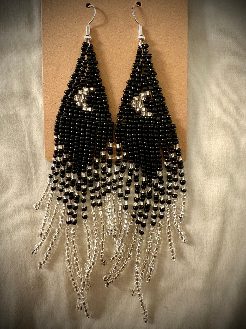 Standing on the Moon beaded fringe earrings on light background