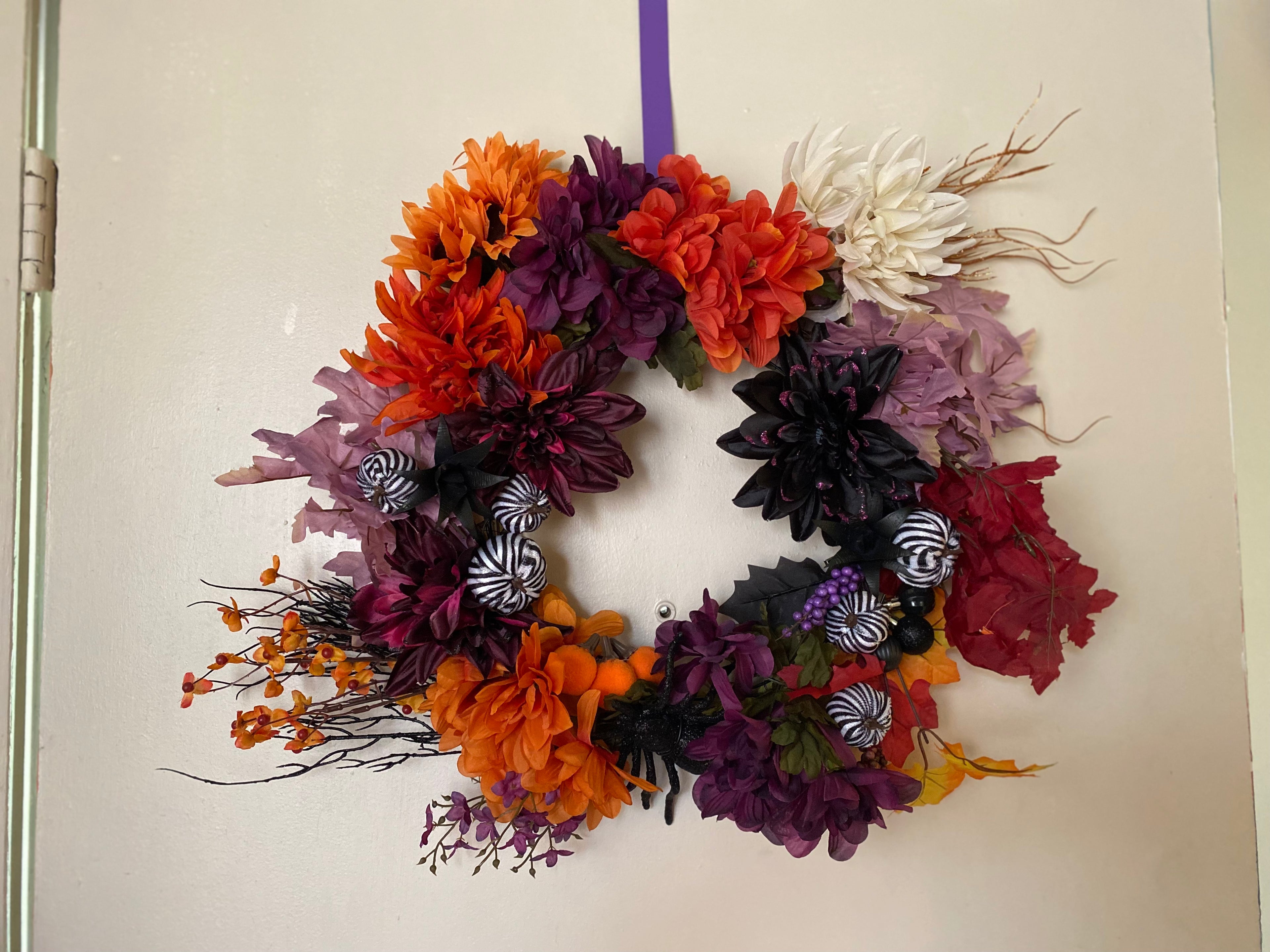 Custom large handmade wreath - Halloween purple and orange on white wall